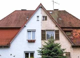 Haussanierung der Fassade einseitig am Doppelhaus